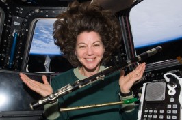 Catherine_Coleman_with_flutes_floating_in_space